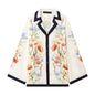 ZERAINS Casual style single row multi button lapel long sleeved contrasting printed shirt and printed pants set
